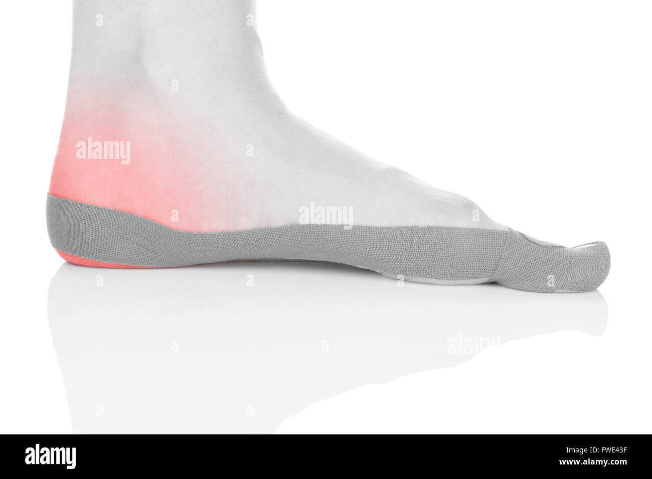 Therapeutic tape on female heel isolated on white background. Chronic pain, alternative medicine. Rehabilitation physiotherapy Stock Photo