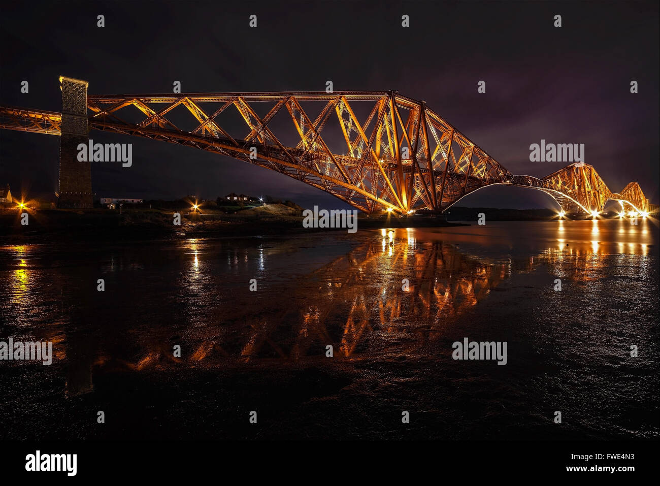 Forth Rail Bridge at night from North Queensferry Stock Photo