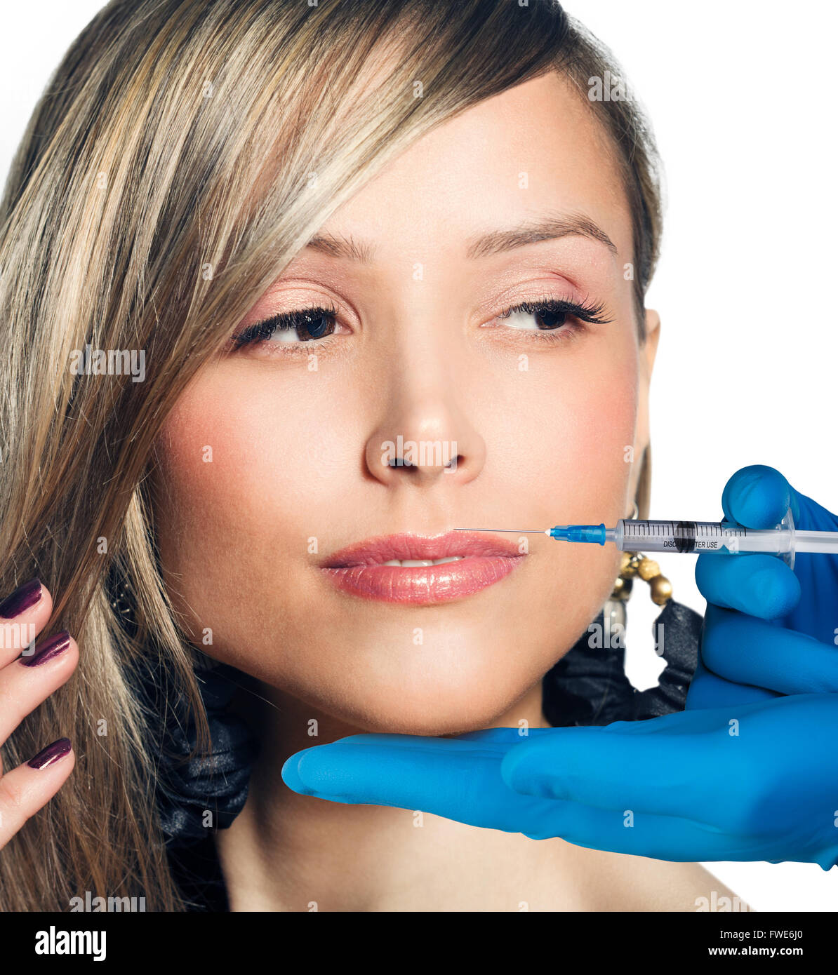 Young woman getting cosmetic injection Stock Photo