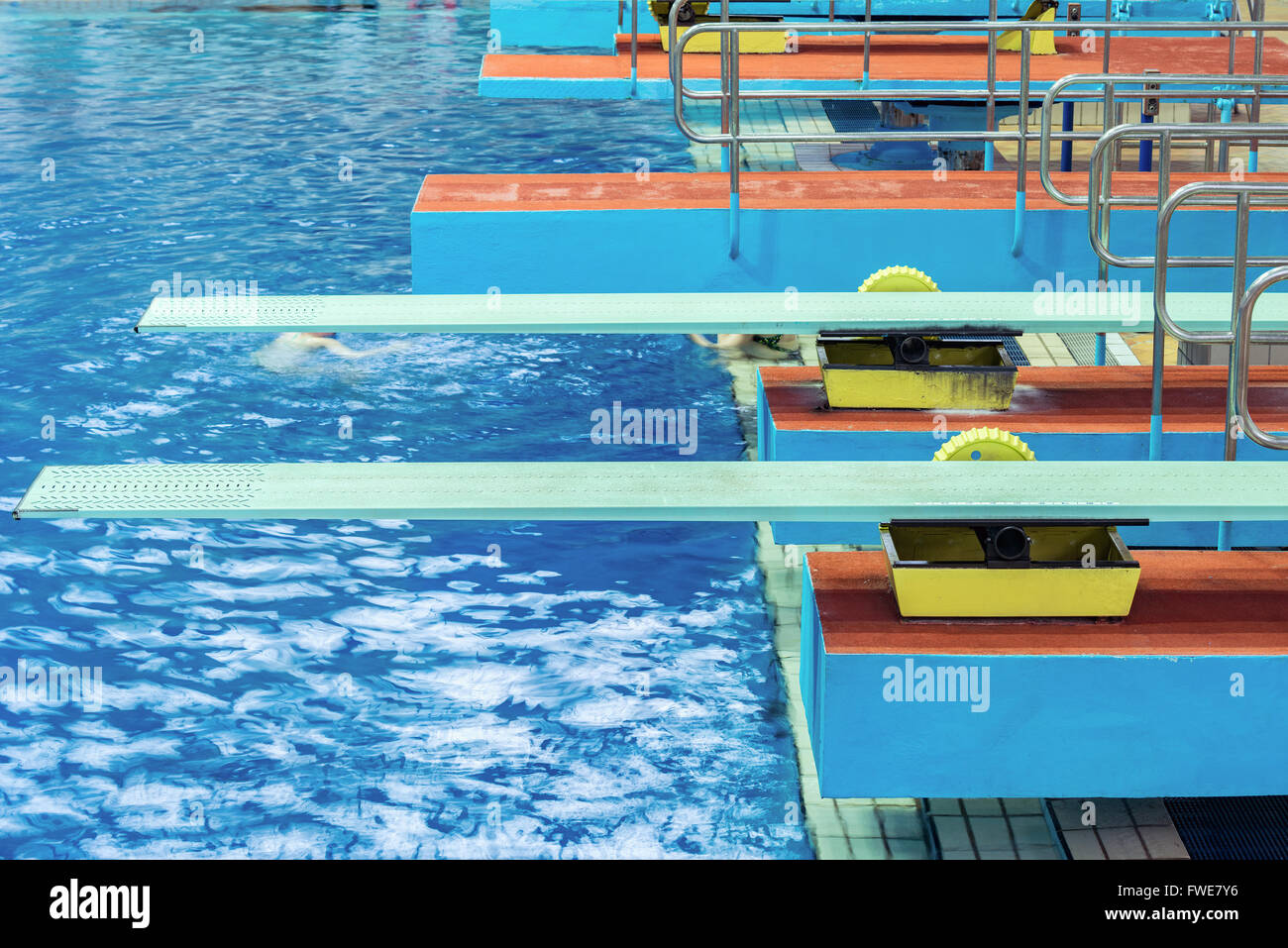 Several diving boards in the swimimg pool. Stock Photo