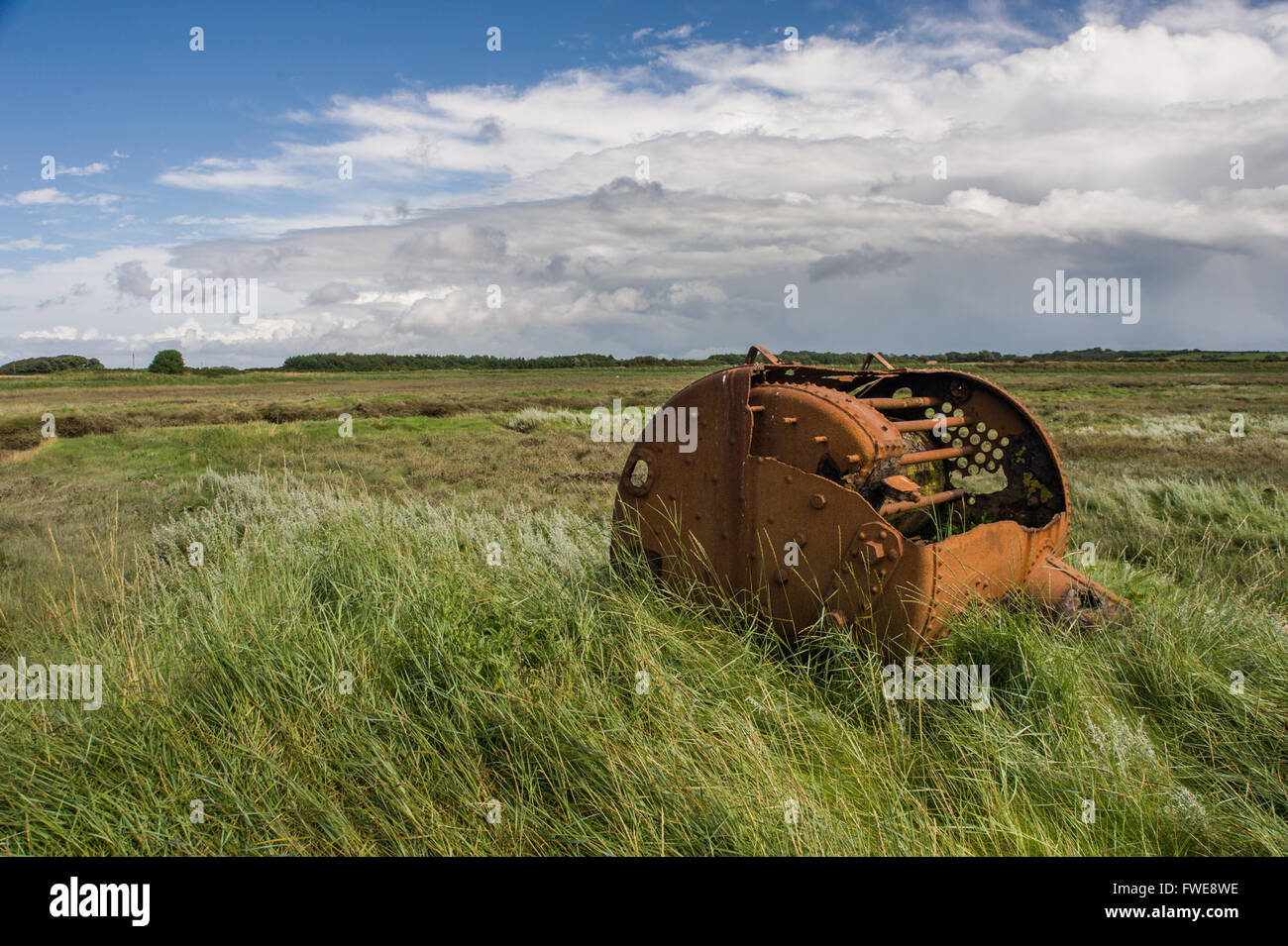 A Rusty ships boiler on the SSSI at Barnaby's Sands Marsh Lancashire Stock Photo