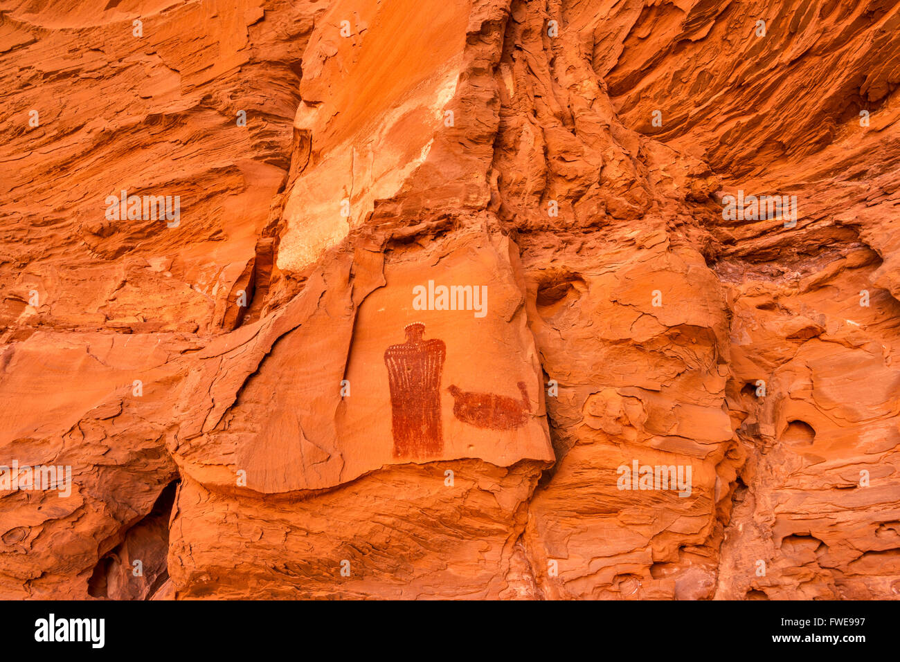 Crowned Figure Pictograph, Barrier Canyon style, rock alcove near Hog Springs Picnic Area, Bicentennial Highway, Utah, USA Stock Photo