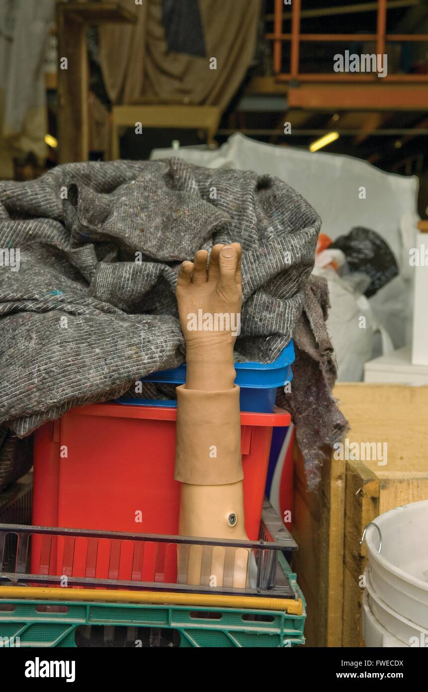 Much Hoole, Preston, Lancashire. An artificial hand limb sits in the warehouse at the International Aid Trust charity shop. The charity raise funds and aid for humanitarian causes across the globe. Stock Photo