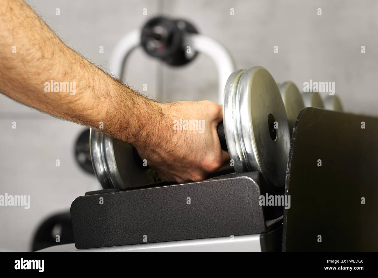 Equipment gym equipment dumbbell, barbell weights.Gym, dumbbells. Trainer in the gym, training