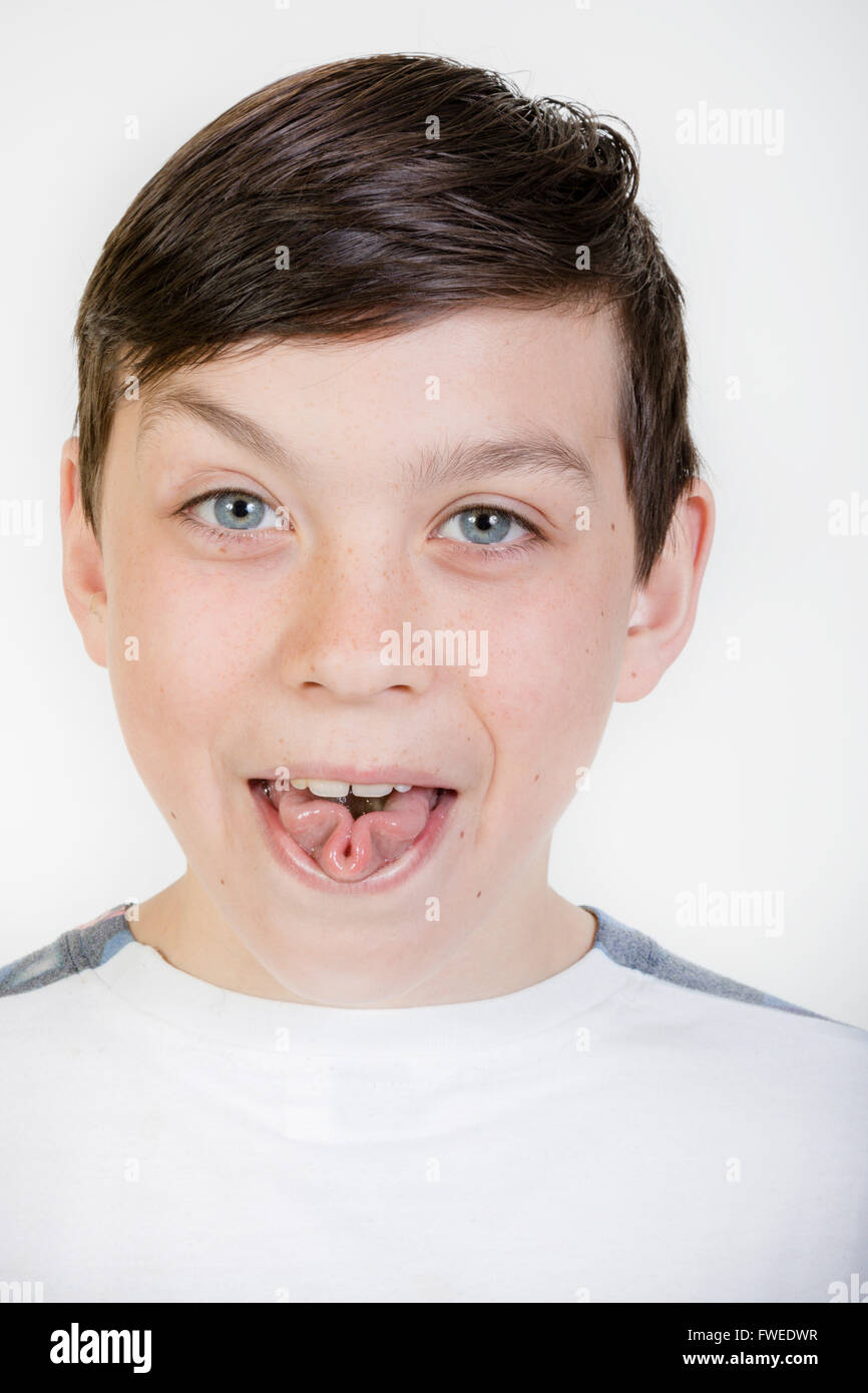 Young boy rolling his tongue Stock Photo