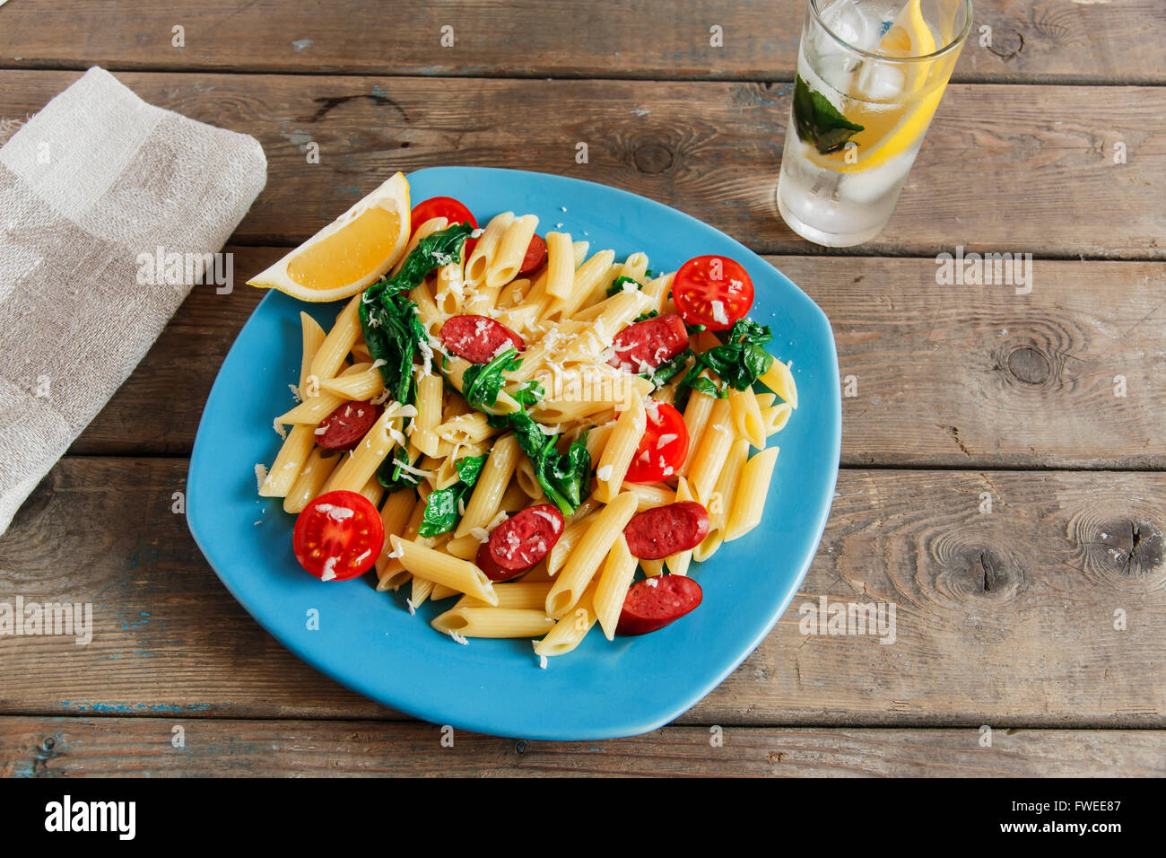 pasta with sausage spinach tomato and cheese Stock Photo