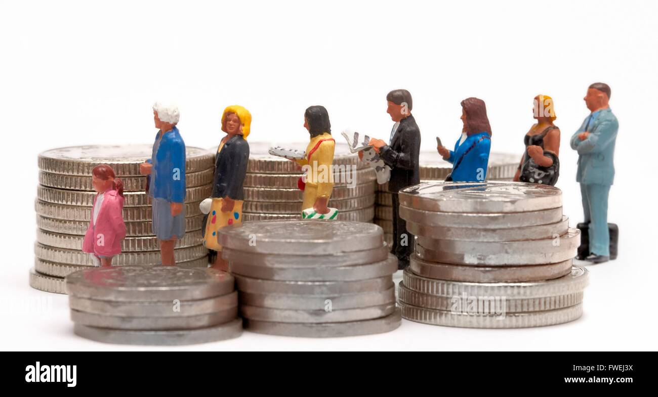 A queue of miniature figurine people next to a pile of coins Stock Photo