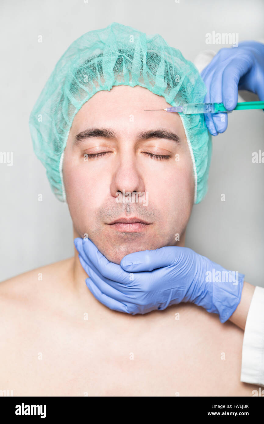 Doctor aesthetician makes hyaluronic acid beauty injections in the