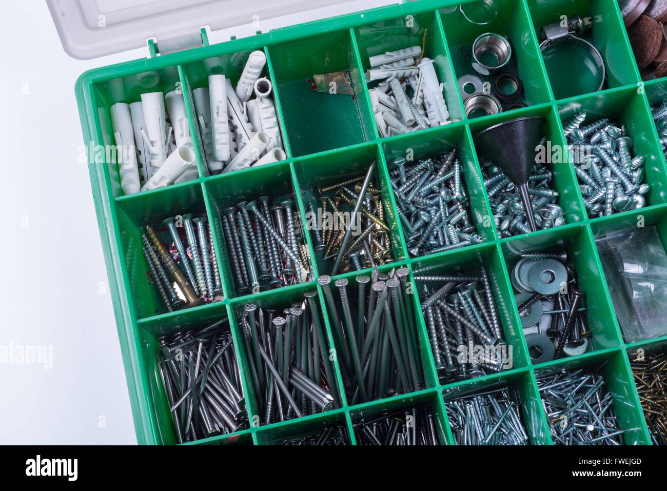 Green box with nails and screws Stock Photo