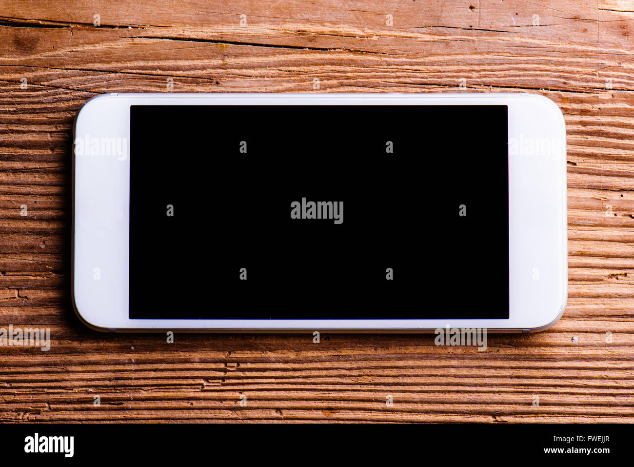 Smartphone laid on an old office desk, copy space Stock Photo - Alamy