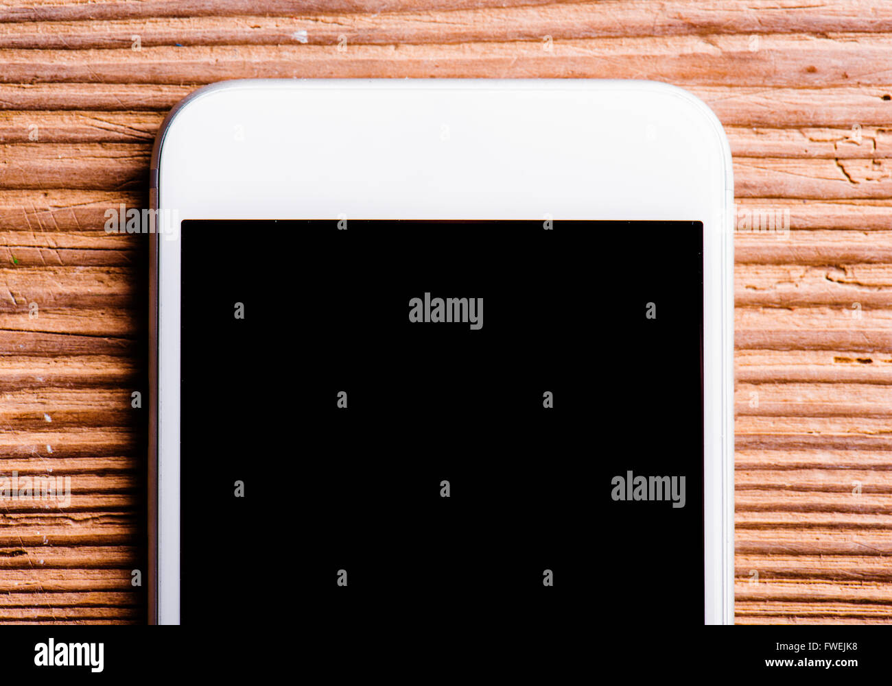 Smartphone laid on an old office desk, copy space Stock Photo - Alamy