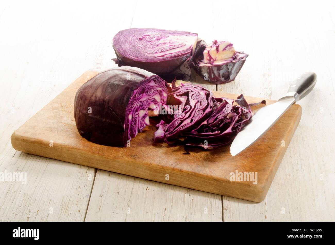 organic red cabbage prepared and sliced on a wooden board Stock Photo