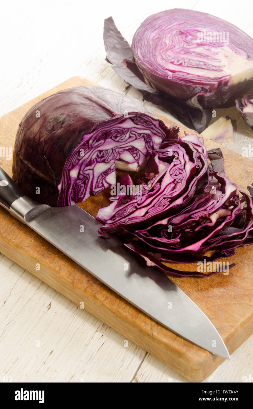 organic red cabbage prepared and sliced on a wooden board Stock Photo