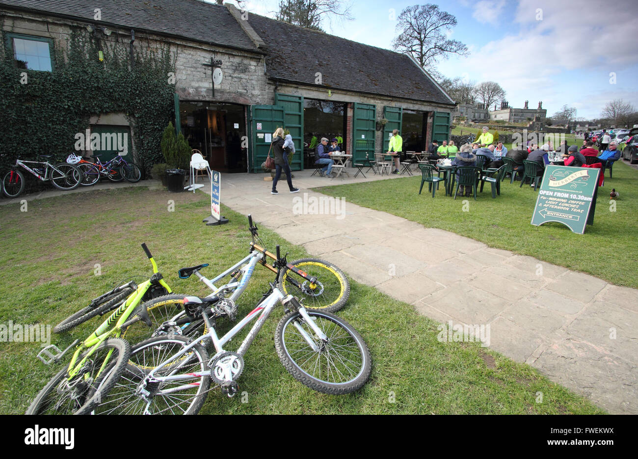 Bikes and customers outside Herbert’s Fine English Tearooms in Tissington; an idyllic village in the Derbyshire Dales England UK Stock Photo
