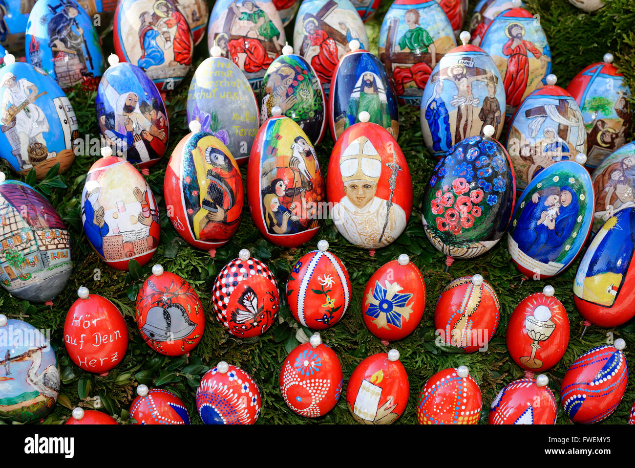 Painted Easter eggs with biblical scenes on an Easter well, Osterbrunnen, Schechingen, Baden-Württemberg, Germany Stock Photo