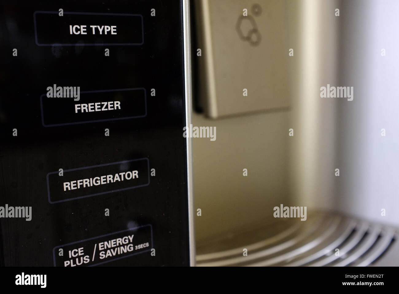 Different function buttons on a modern fridge. Stock Photo