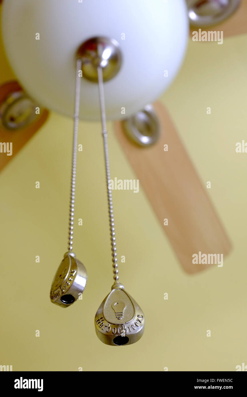 A ceiling fan switch hanging from a cord. Stock Photo