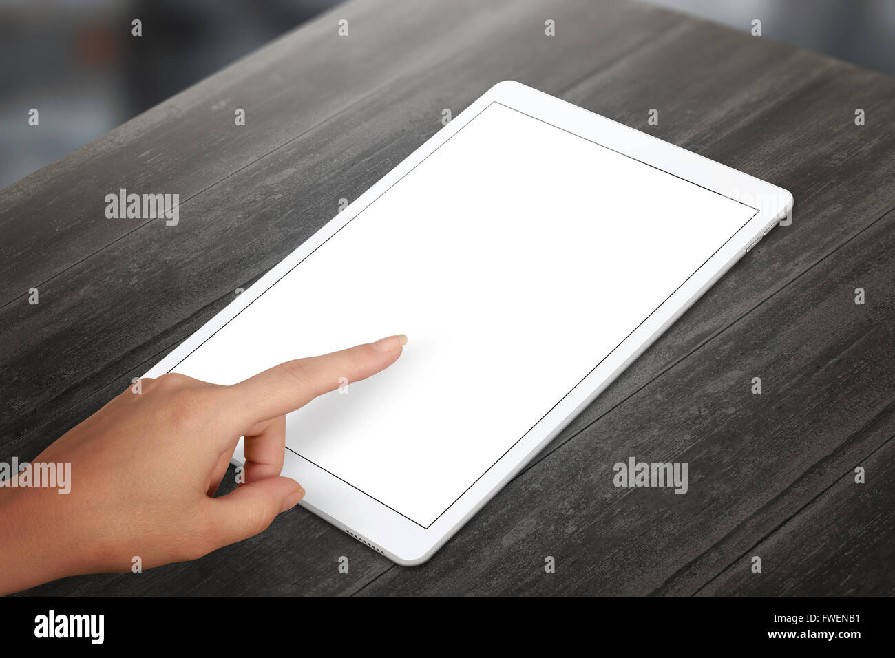 Woman hand touch tablet isolated white screen. Vertical position