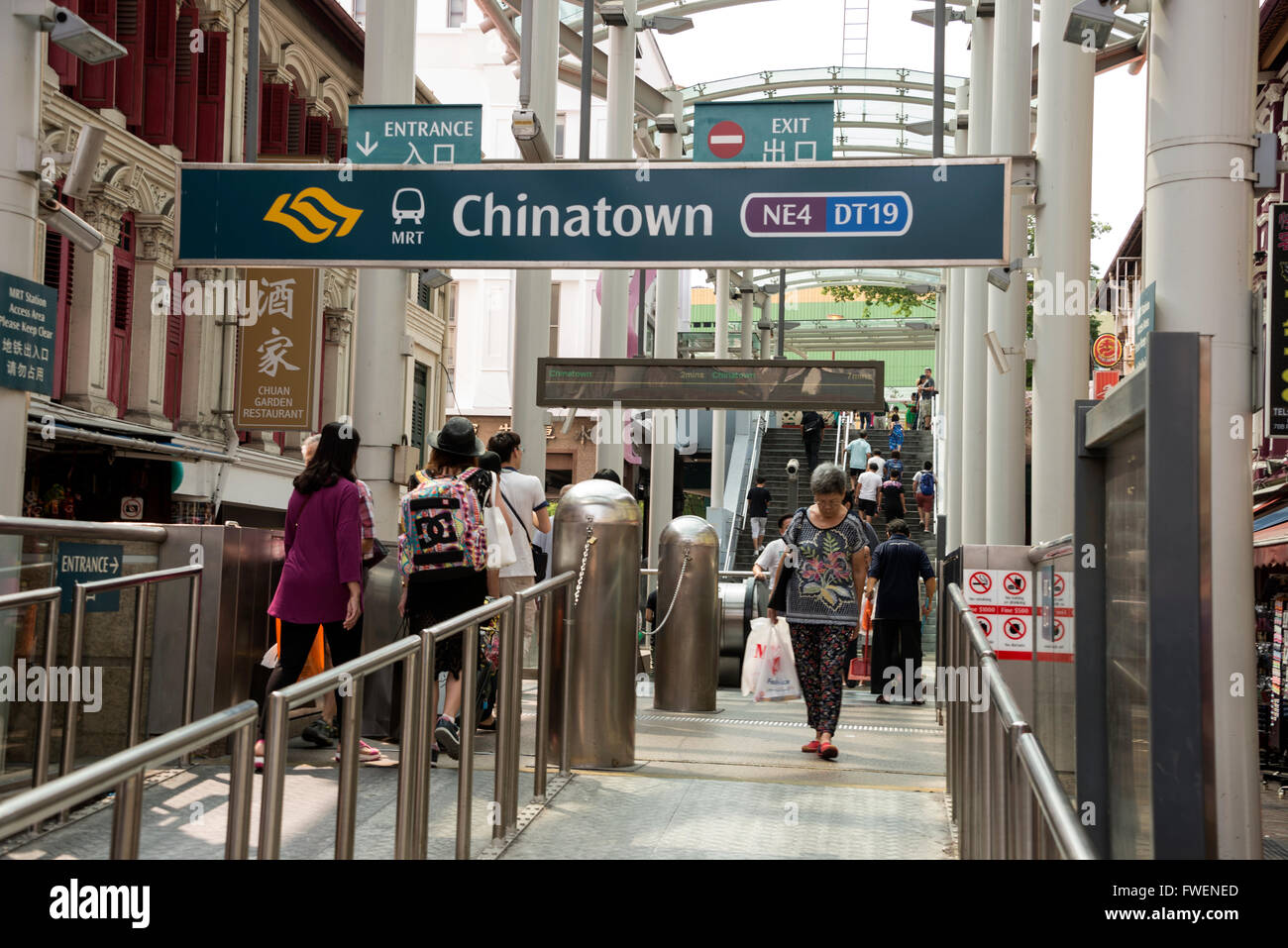 Commuters at Chinatown MRT ( Mass Raid Transit) rail station in Chinatown in Singapore Stock