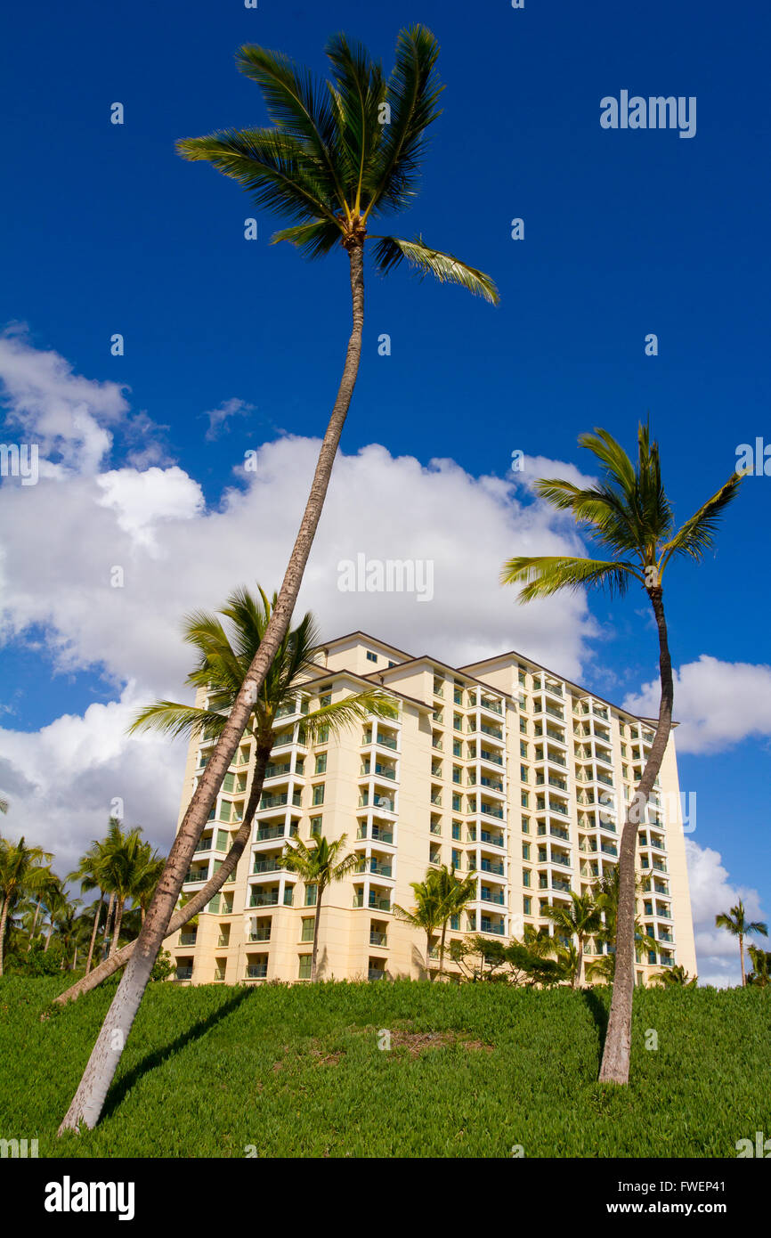 Palm trees stand in front of this beautiful time share condo hotel building on the island of Oahu Hawaii. This resort is in a tr Stock Photo