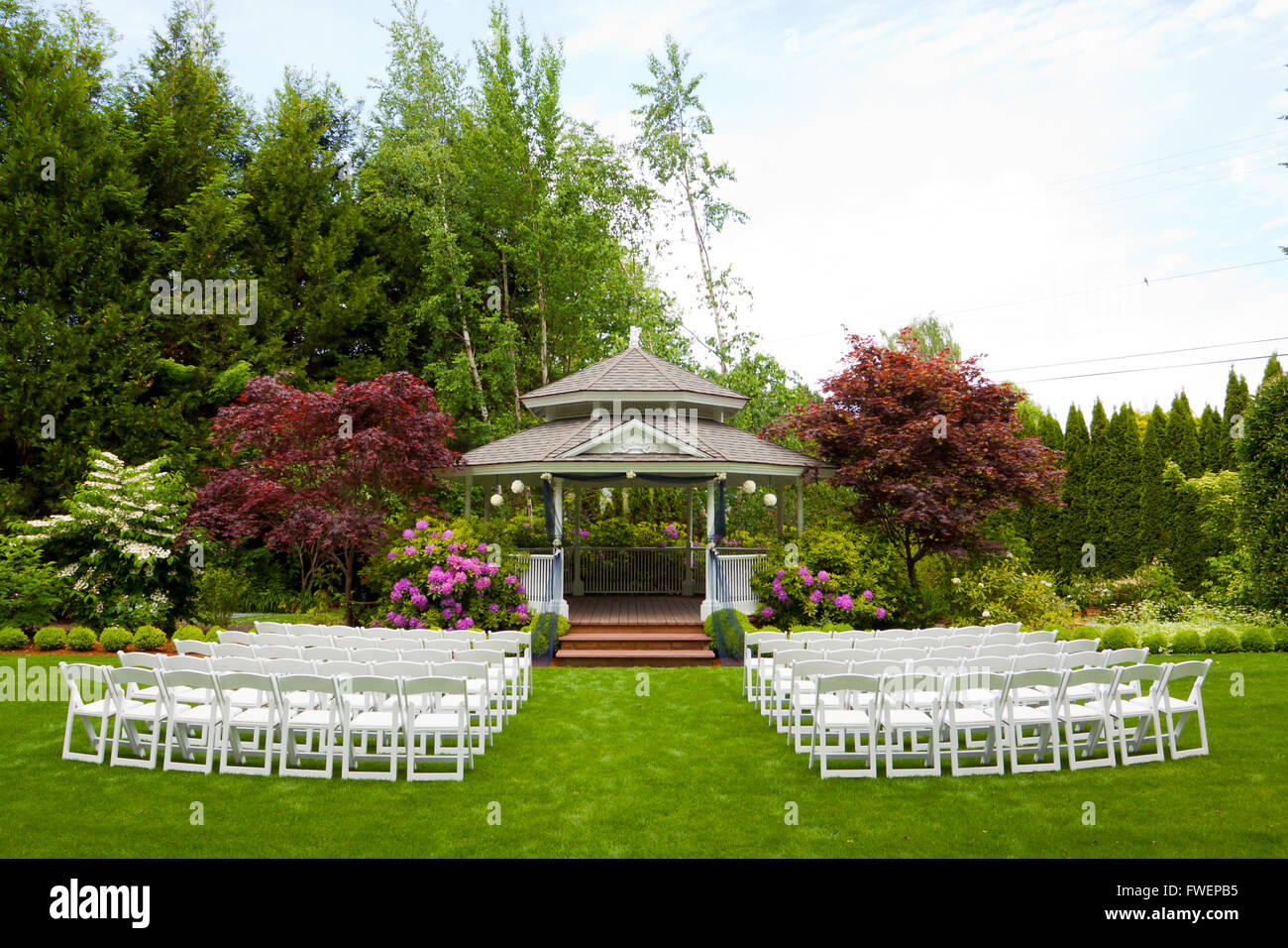 Outdoor Wedding Venue In Oregon With Green Grass And Chairs Ready