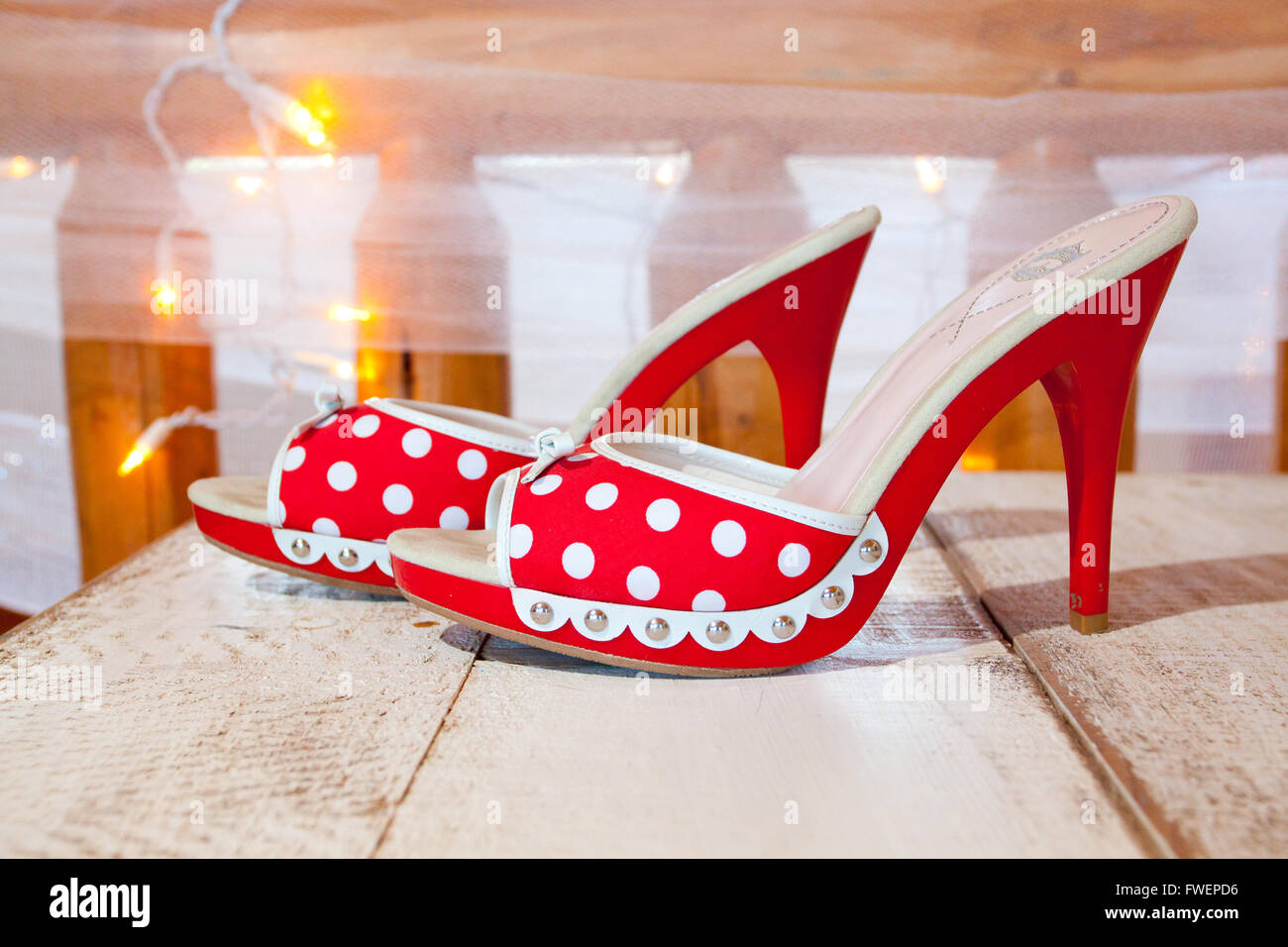 A bride s wedding shoes in red and white with polkadots and heels Stock Photo Alamy