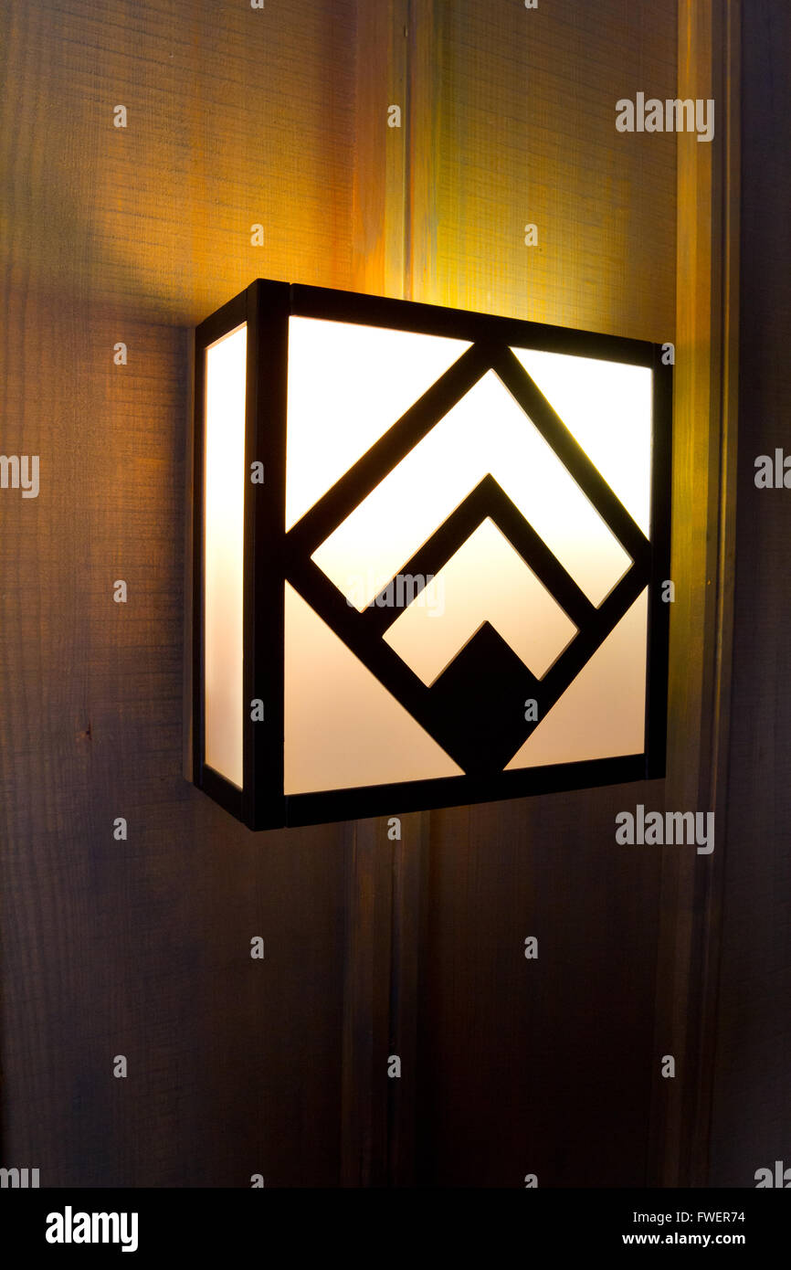 Historic Timberline lodge light fixtures on an old wooden wall in a hallway. Stock Photo