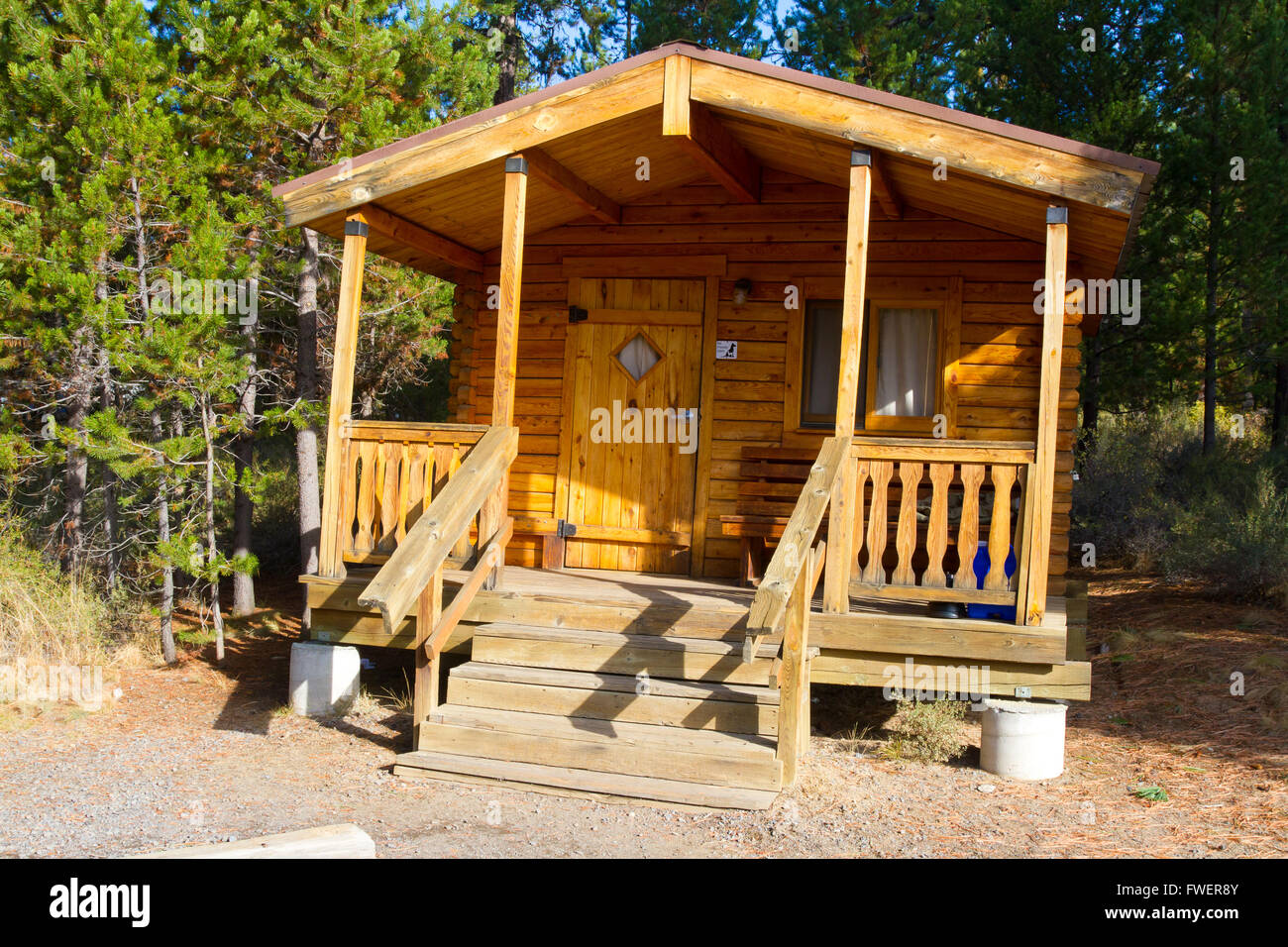 A rustic log cabin lodge building in the woods at an outdoors camping park facility.f Stock Photo