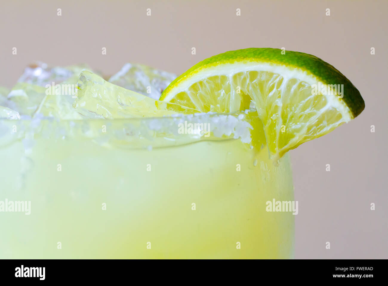 Margaritas at a Mexican restaurant with a shot of tequila and a lime. Stock Photo