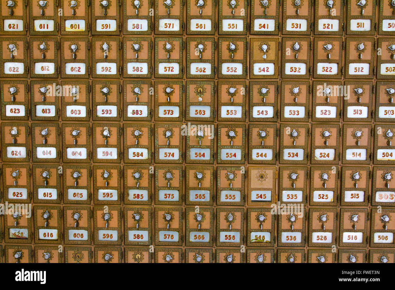 This photo shows the many po boxes at the post office. The mail boxes