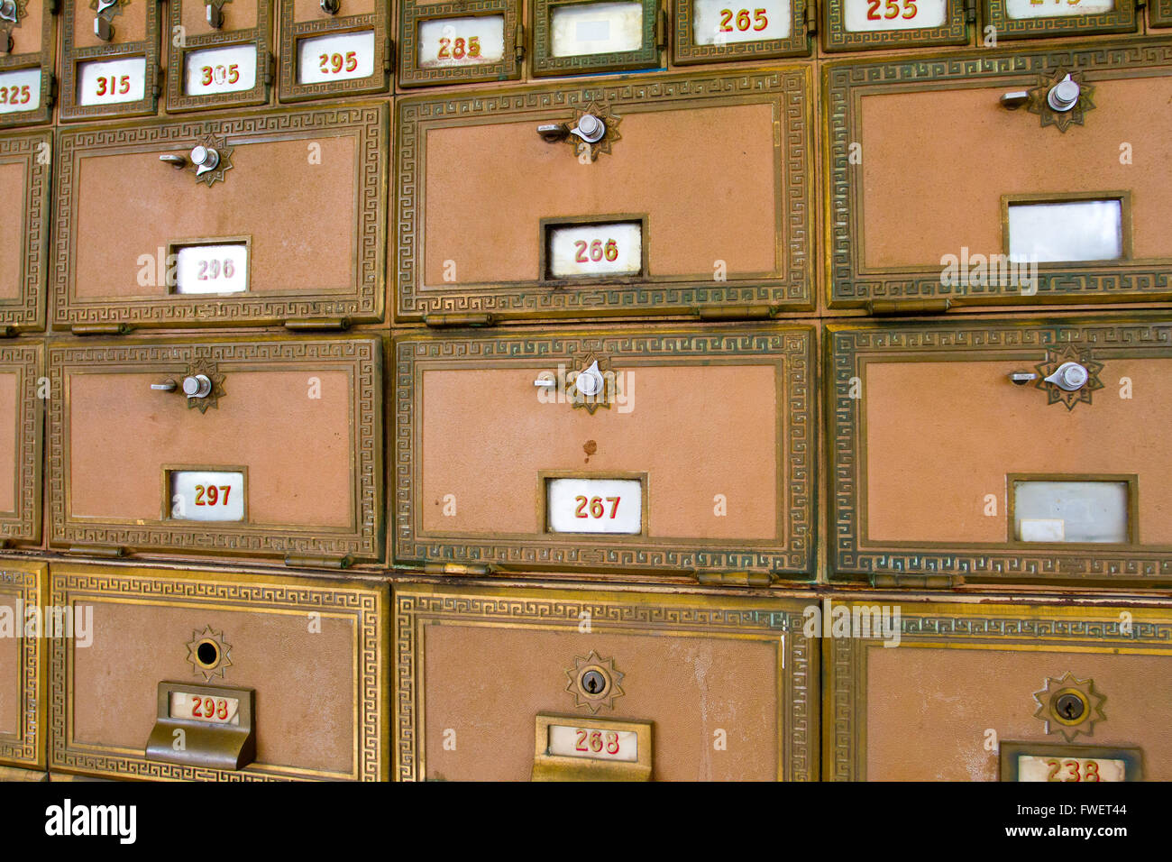 This photo shows the many po boxes at the post office. The mail boxes