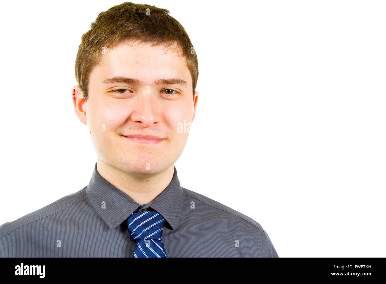 A young adult college student is photographed in the studio agains an