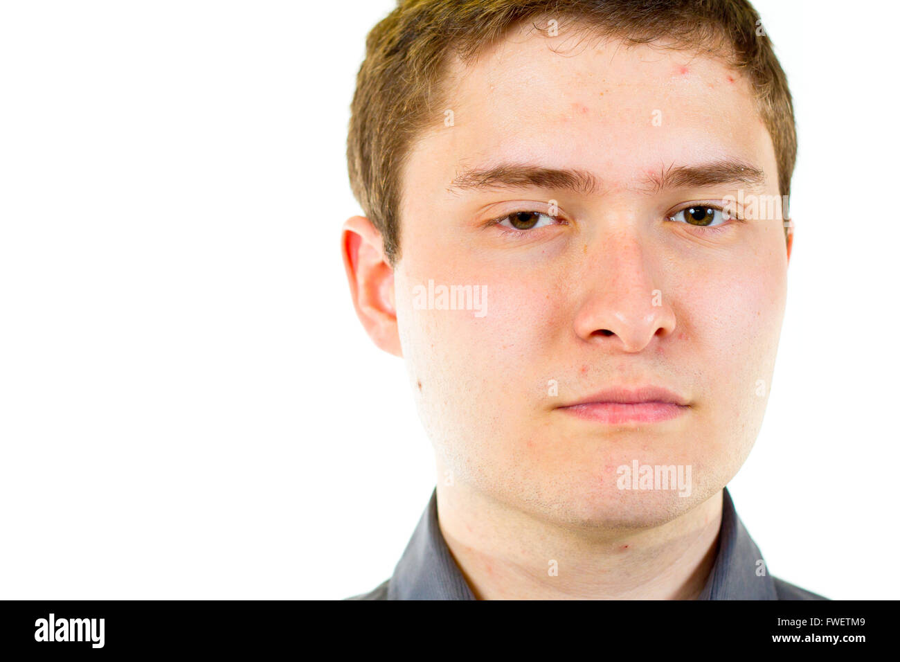 A young adult college student is photographed in the studio agains an