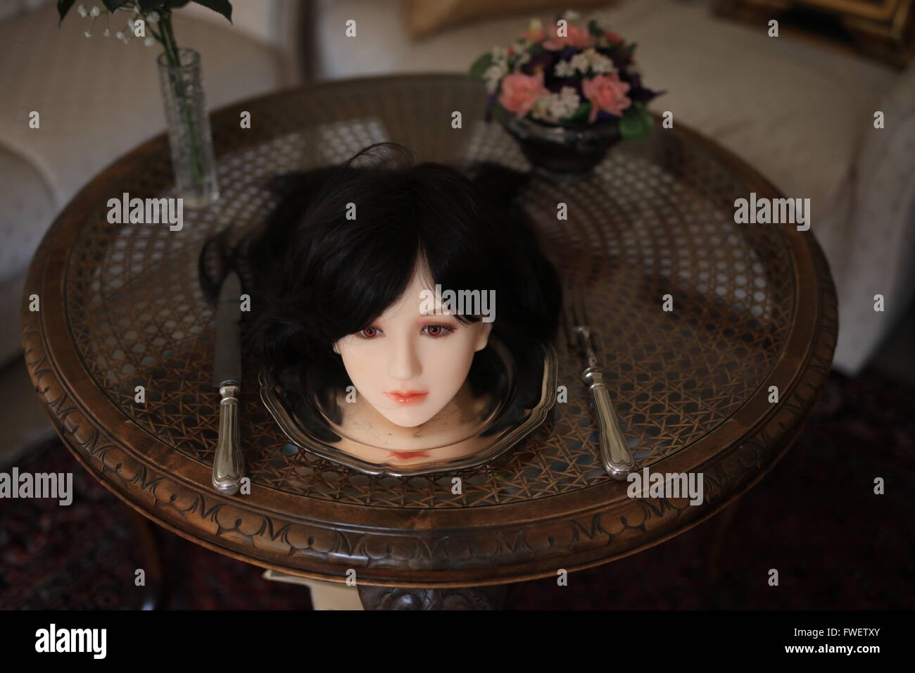 Female Head On A Silver Plate With Cutlery Stock Photo Alamy