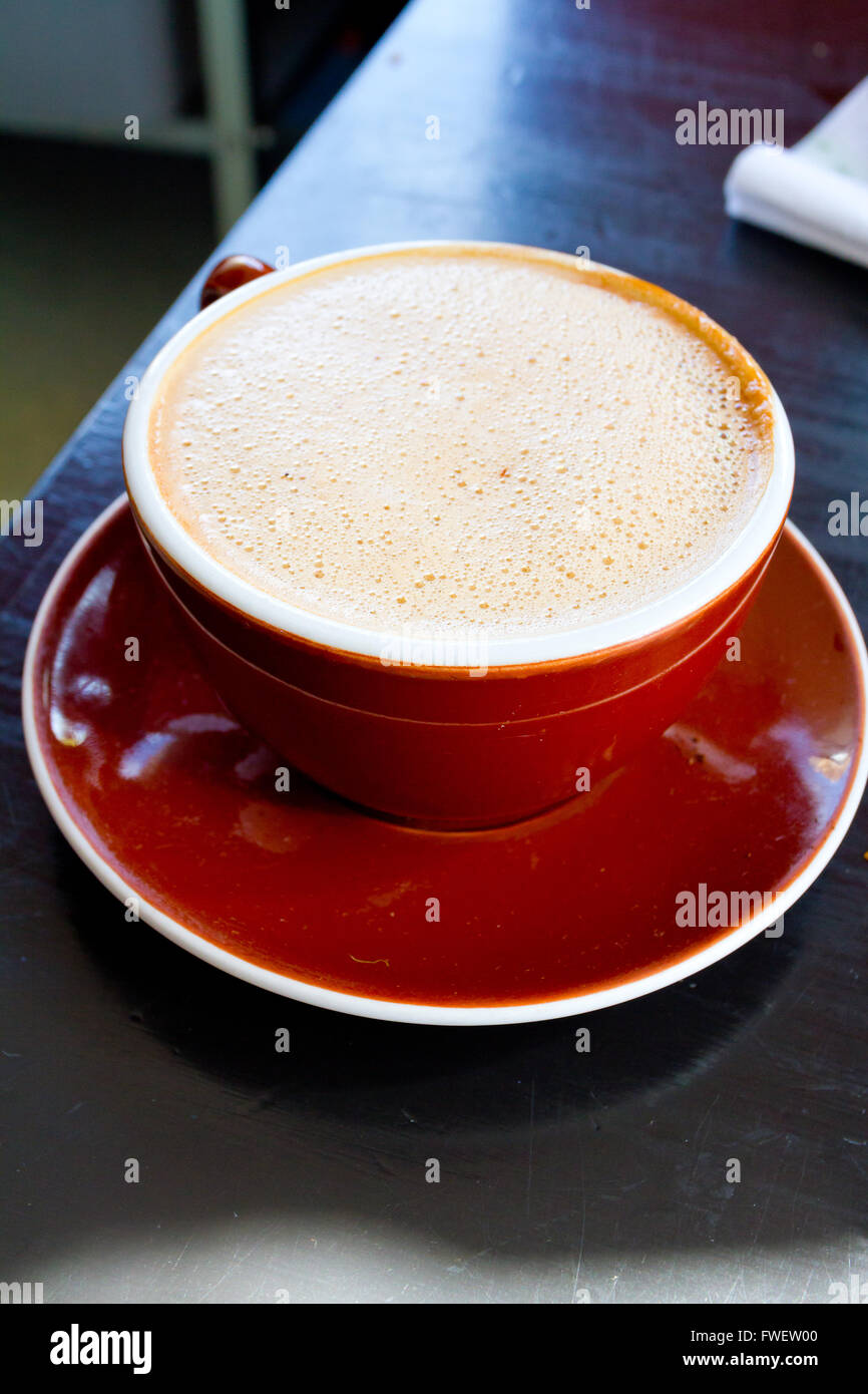 A mocha is served in a ceramic mug at a restaurant that makes amazing coffee and latte. Stock Photo