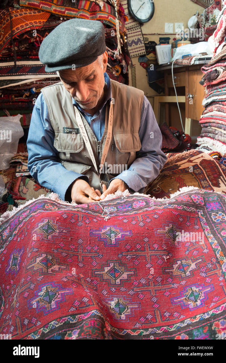 Carpet trader, Mashhad, Iran, Western Asia Stock Photo