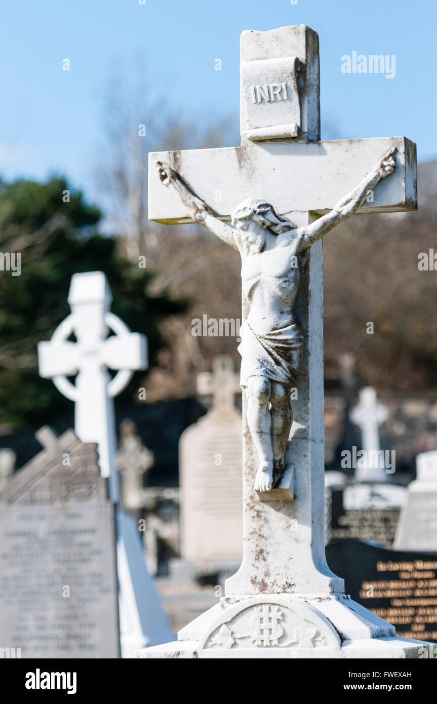 Crucifix gravestone in an Irish graveyard. Stock Photo
