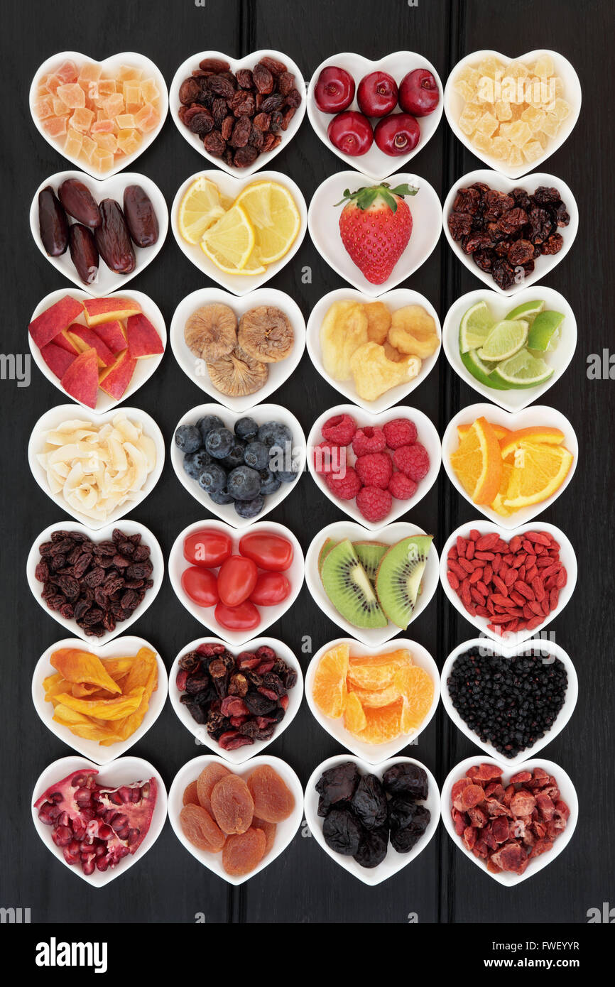 Large mixed fruit background super food selection with fruits high in