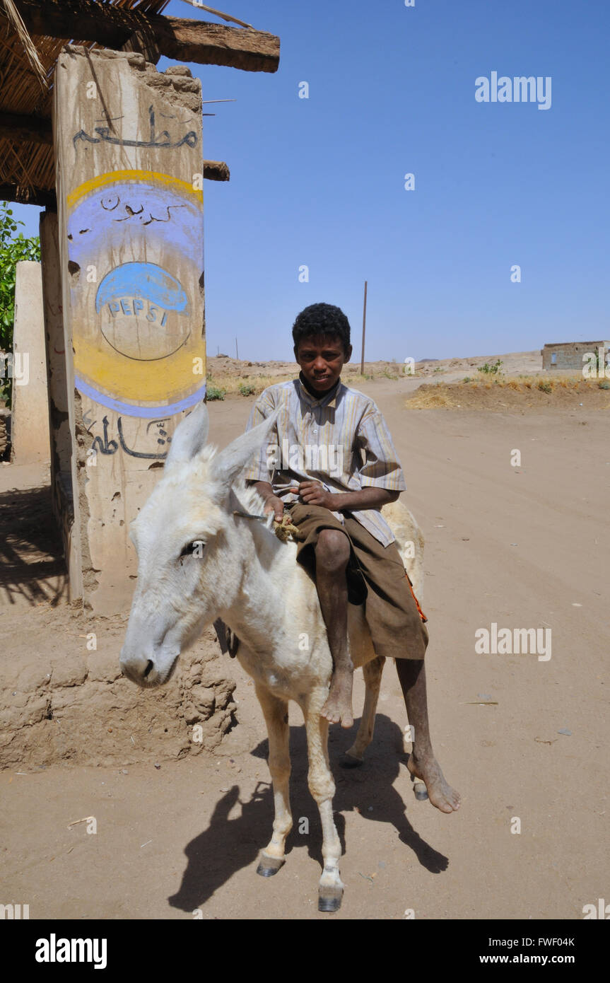 Nubian boy Riding DOnkey, Delgo Ferry Crossing Stock Photo Alamy