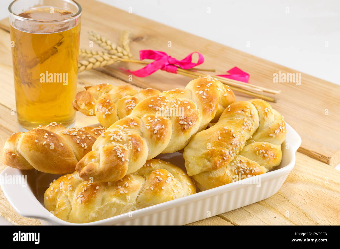 Homemade braid pastry on a plate and glass of beer Stock Photo