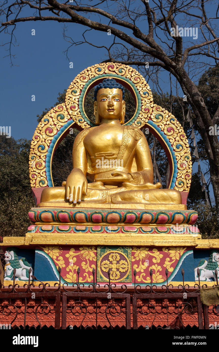 Nepal, Kathmandu, Swayambhunath.  Buddha Statue Demonstrating the 'Earth is my Witness' Gesture.  (Bhumisparsha Mudra). Stock Photo