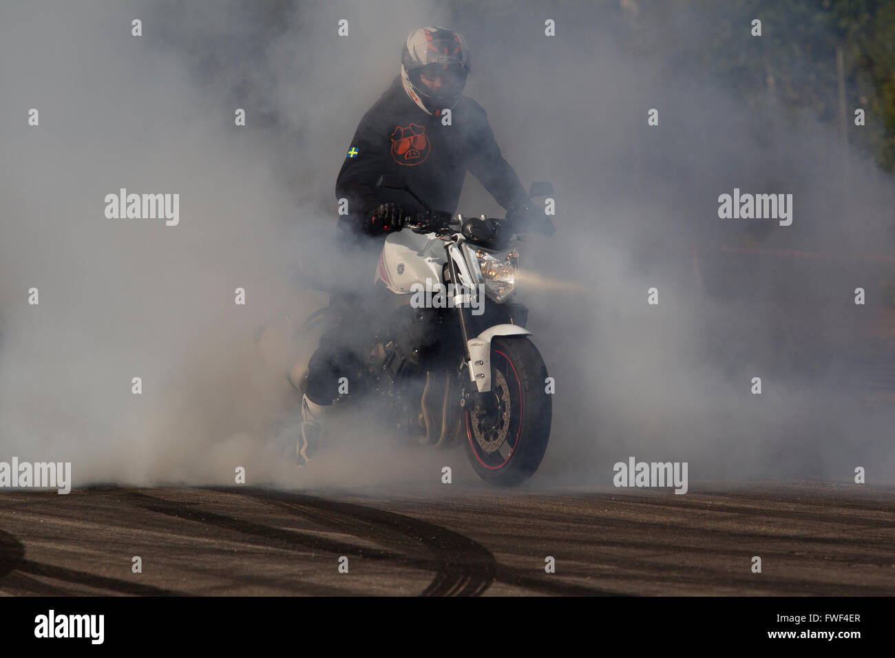 Superbike makes a very smoky burnout Stock Photo