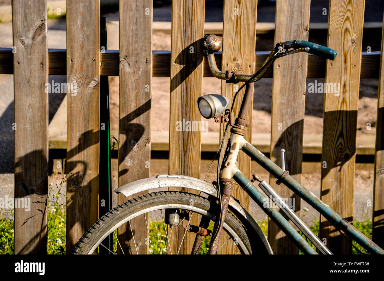 a very old and rustic bicycle in the garden Stock Photo