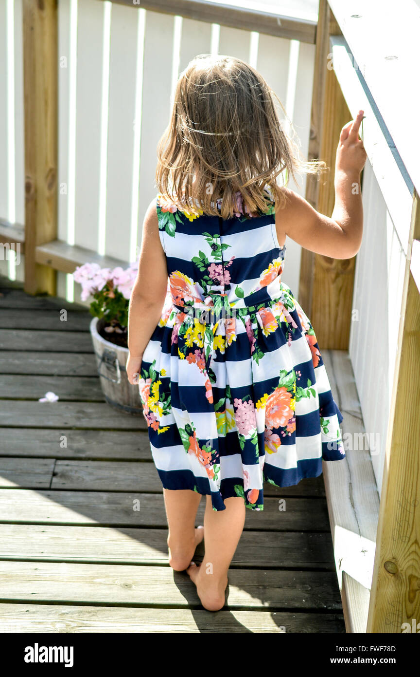 a cute girl is posing in beautiful dress Stock Photo