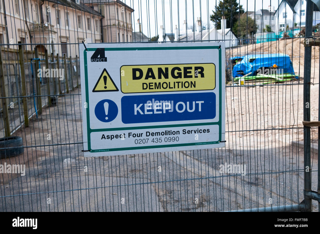 Sign on a building site saying Danger Demolition Keep Out Stock Photo