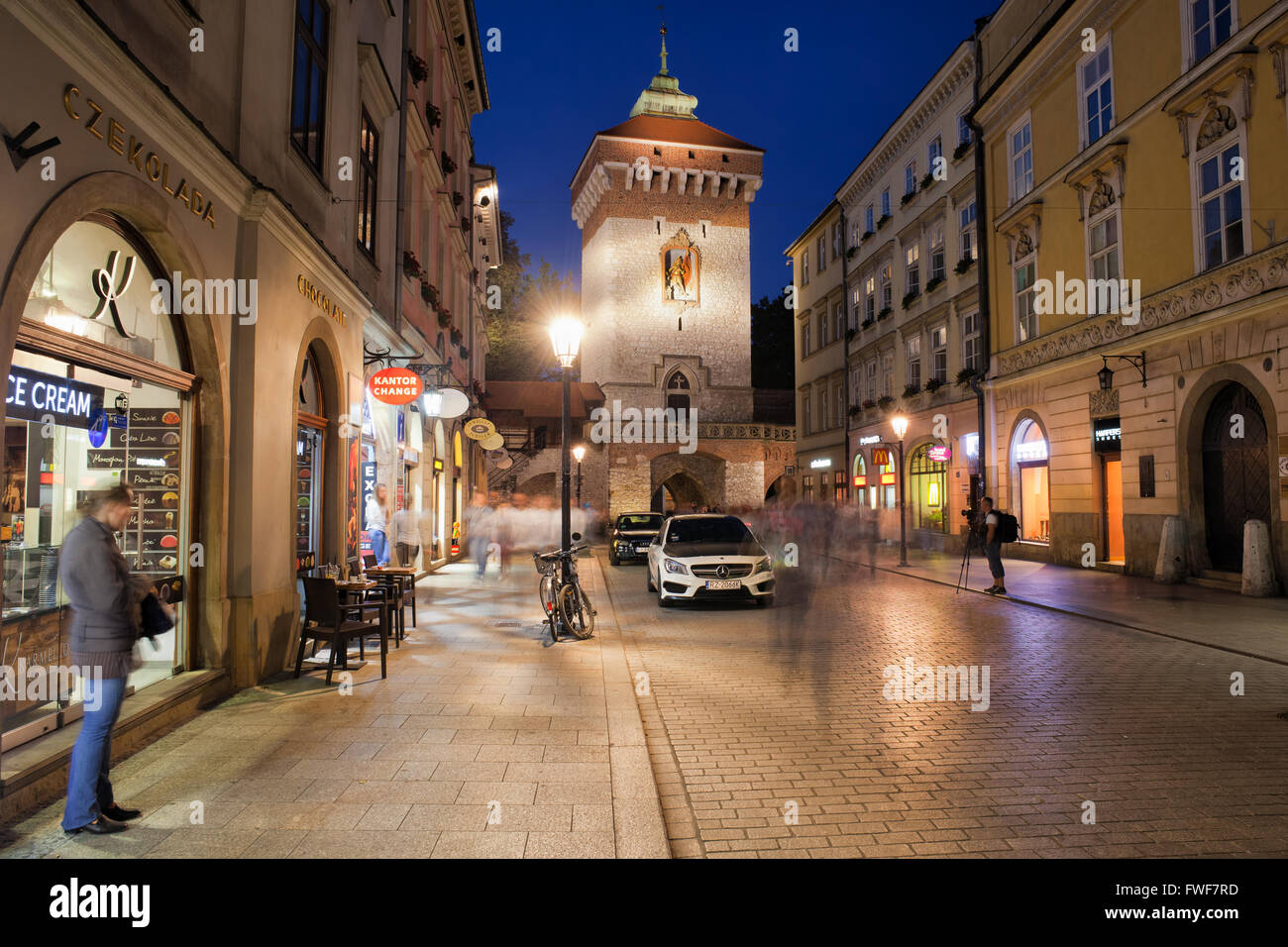 Poland, city of Krakow (Cracow), Old Town, St. Florian Gate (Brama Florianska) and Florianska Street at night Stock Photo