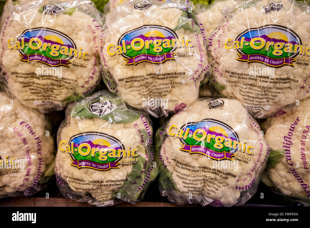 a display of organic cauliflower at a Whole Foods Market in the produce section Stock Photo