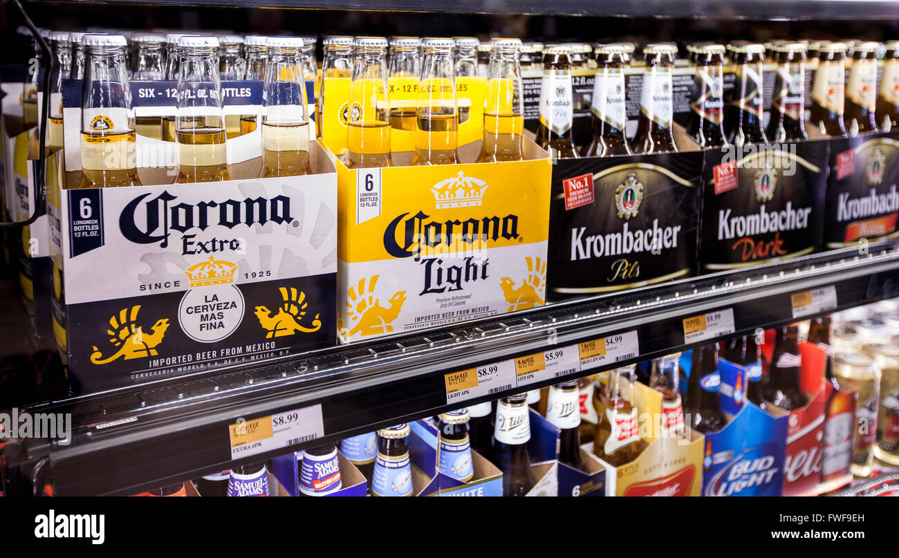 6 packs of bottled Corona beer on a refrigerator shelf at a grocery store Stock Photo