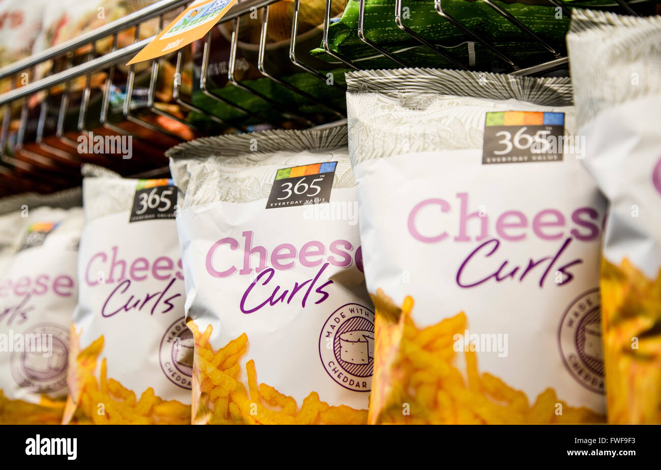 bags of 365 Whole Foods brand cheese curls on a grocery store shelf Stock Photo