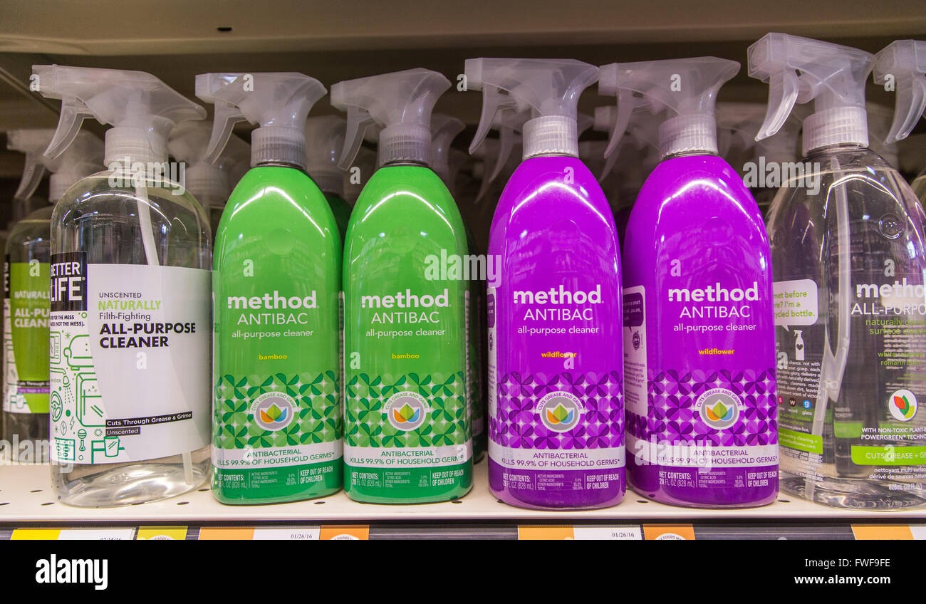 a display of Method cleaning spray bottles on the shelf of a grocery